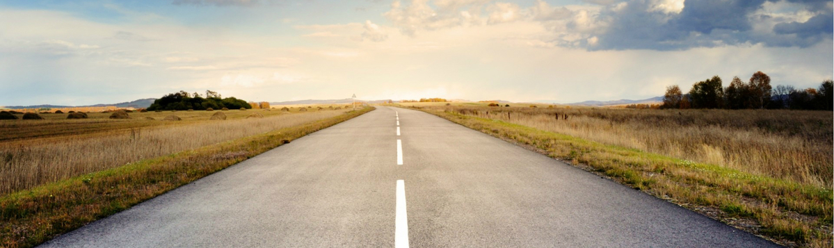 Empty road to symbolize that knowledge and quality management in a systems engineering organization is a milestone for better projects