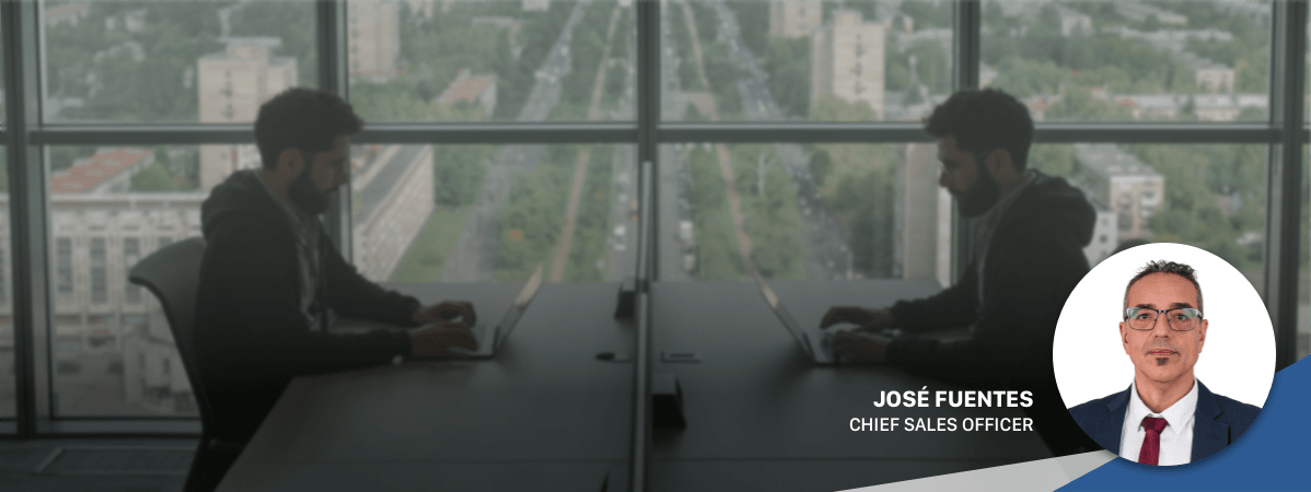 Mirrored image of a man working on a computer to represent the duplicated and overlapped requirements